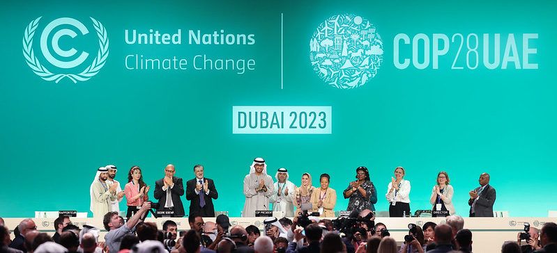 COP 28 participants congratulating themselves